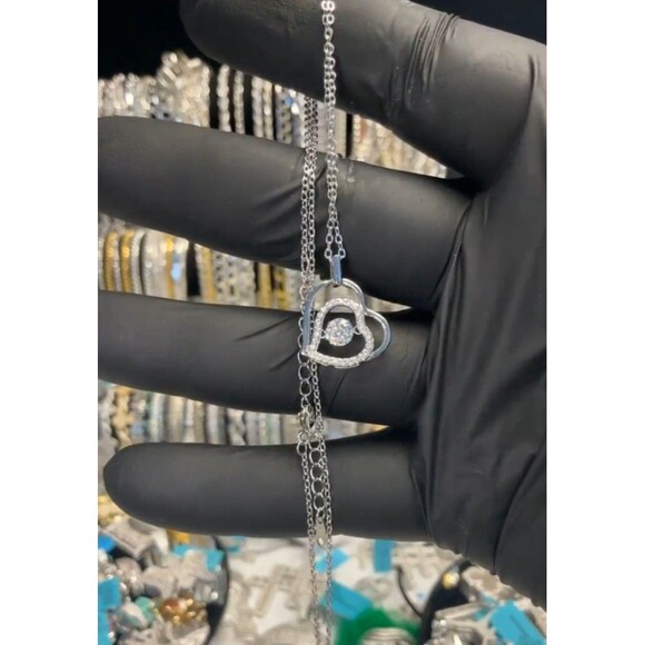 The Glow Show Jewelry - 0.5ct VVS1 Moissanite In Motion double Heart Pendant W/ 18" Chain In 925 Silver
